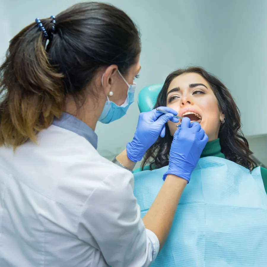 Home 4 Dentist examining a patient in the dental chair at The Master Dentist, Islamabad