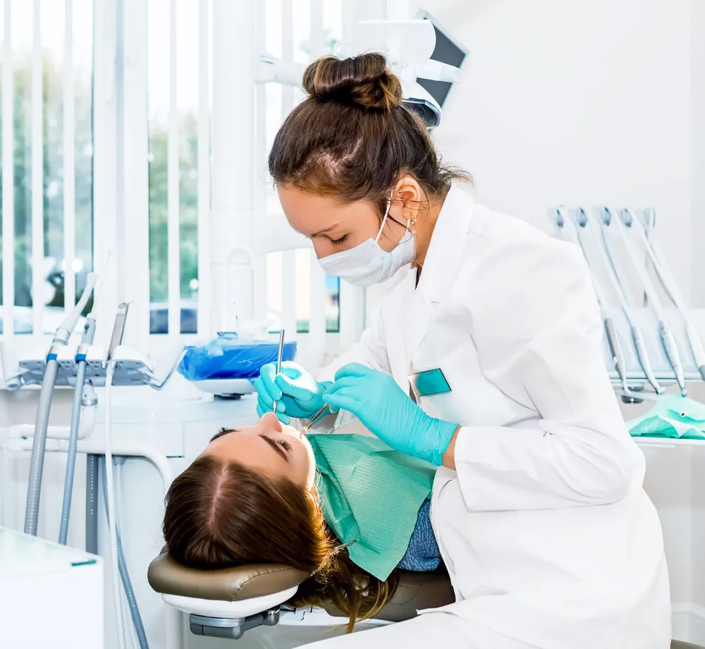 Dentist performing a dental check-up on a patient at The Master Dentist clinic in Islamabad